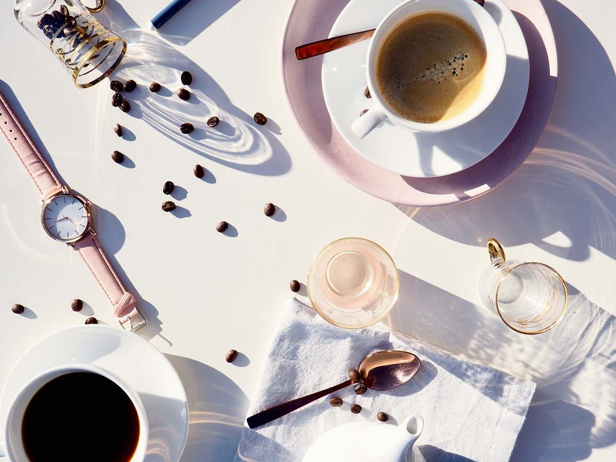 drink flat lay photography of teacup, saucer, watch, cup, and spoon cup